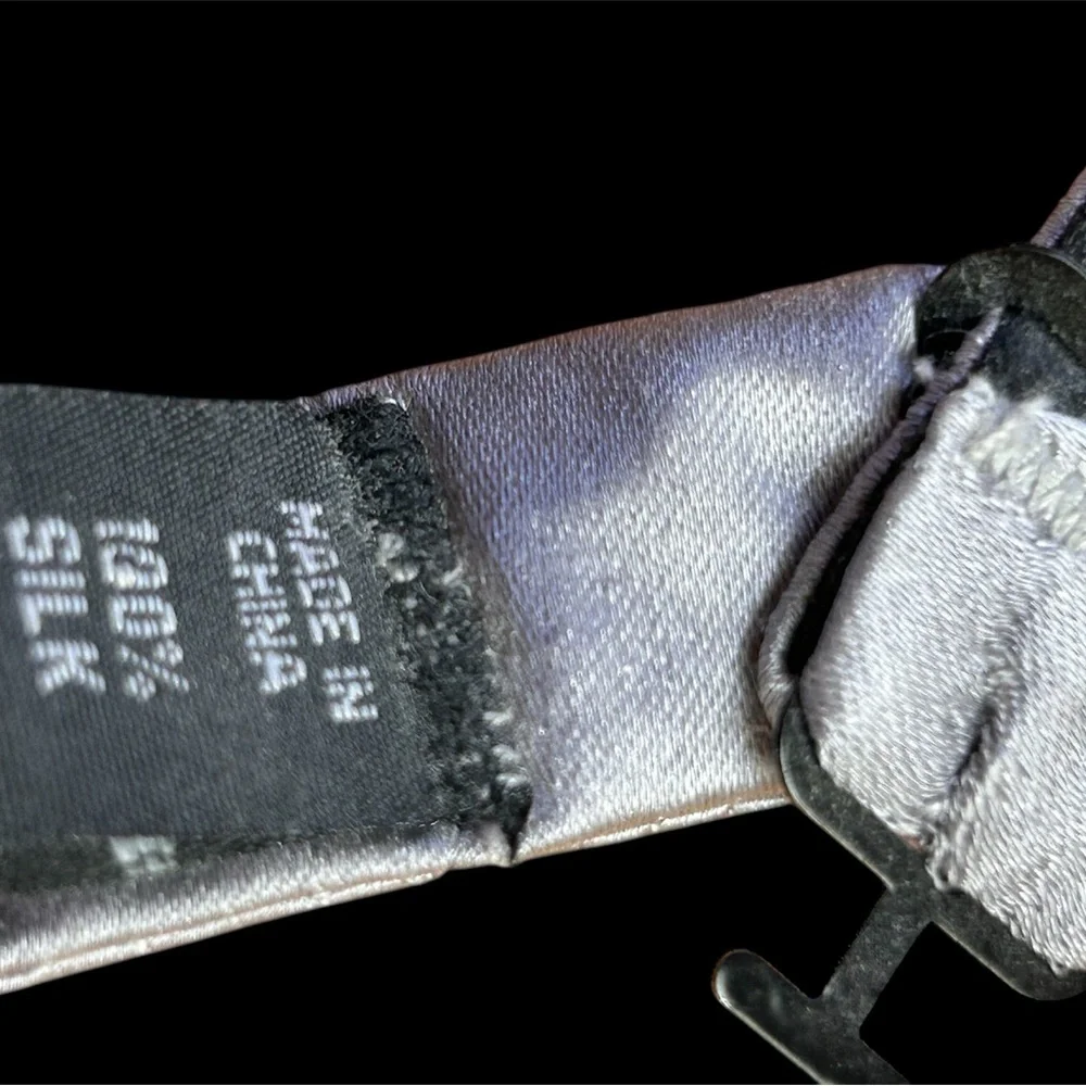 This 100% silk gray bow tie is a staple accessory for any man's formal wardrobe.